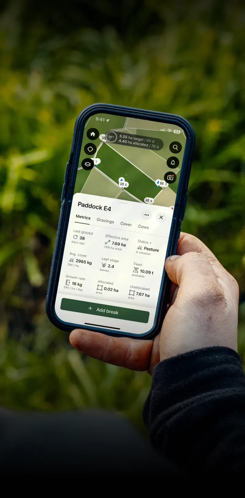 The Halter mobile app showing a satellite map of farmland with virtual fence boundaries drawn by the farmer and the real-time locations of individual cattle marked on the map.
